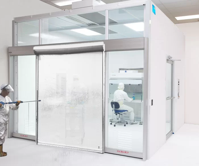 AUTO PHARMA clean room high speed door being cleaned